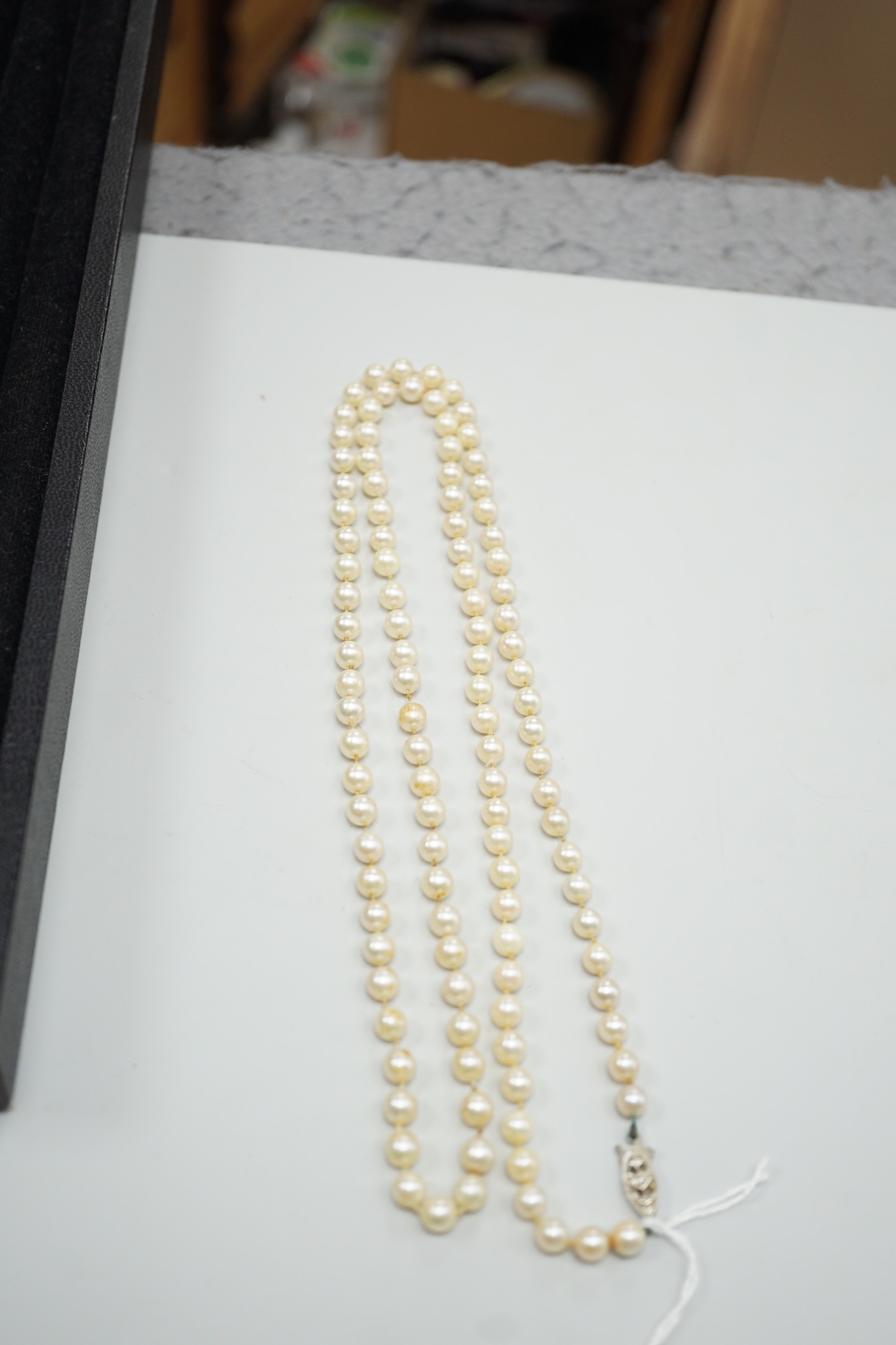 A single strand cultured pearl necklace, with 9ct white gold and diamond chip set clasp, 80cm.